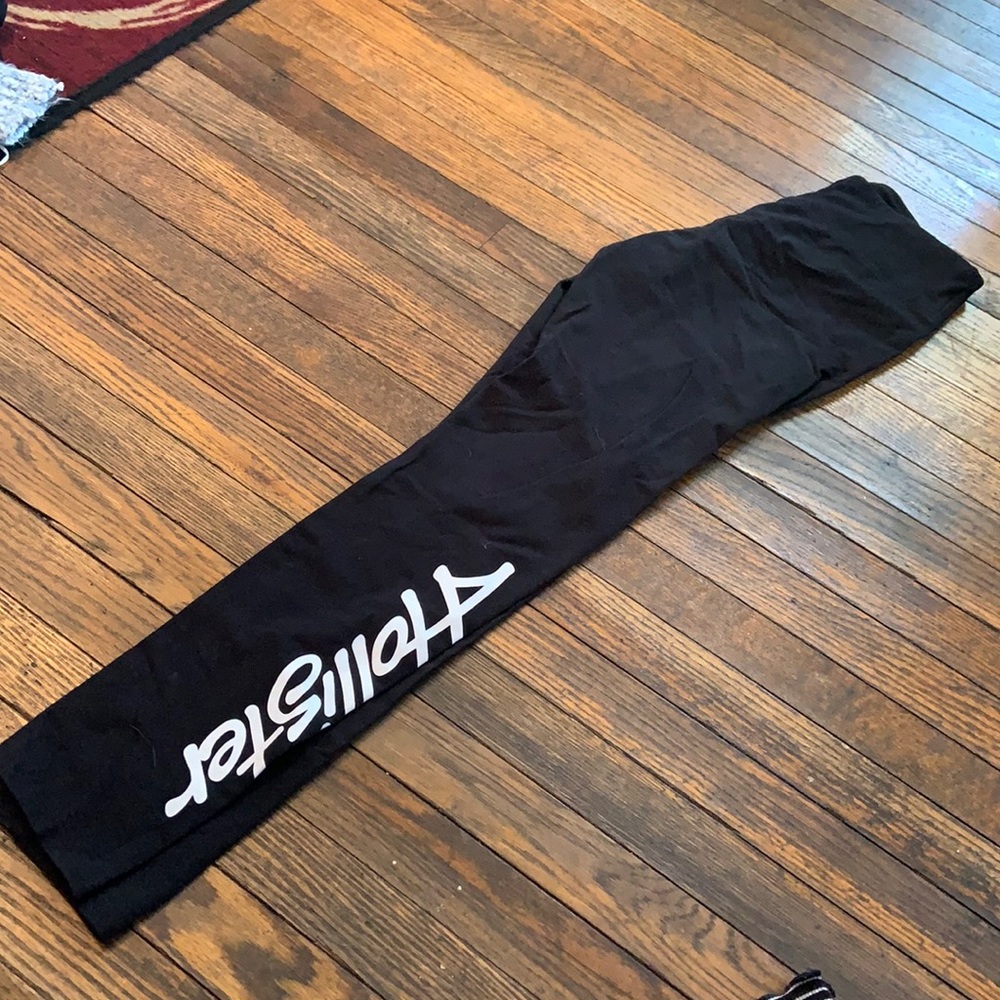 Black Hollister leggings with white writing